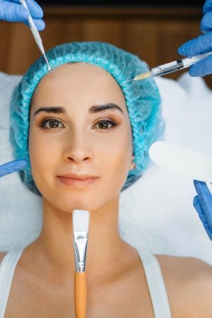 cosmetician-hands-with-working-tools-patient-face.jpg